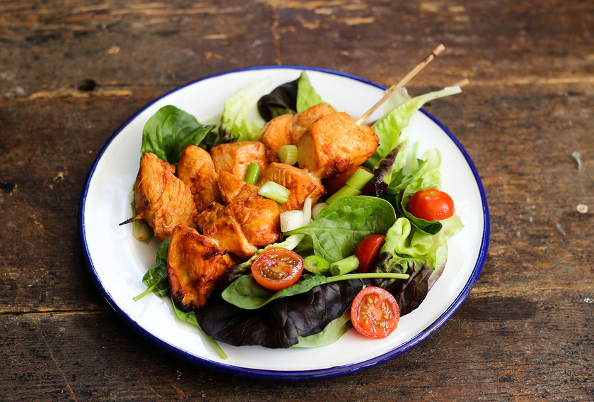 Colourful chicken kebabs with grilled pineapple, peppers, and mango chunks on skewers