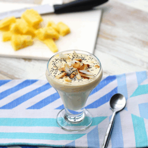 Tropical yogurt parfait with fresh pineapple, coconut flakes, and toasted granola
