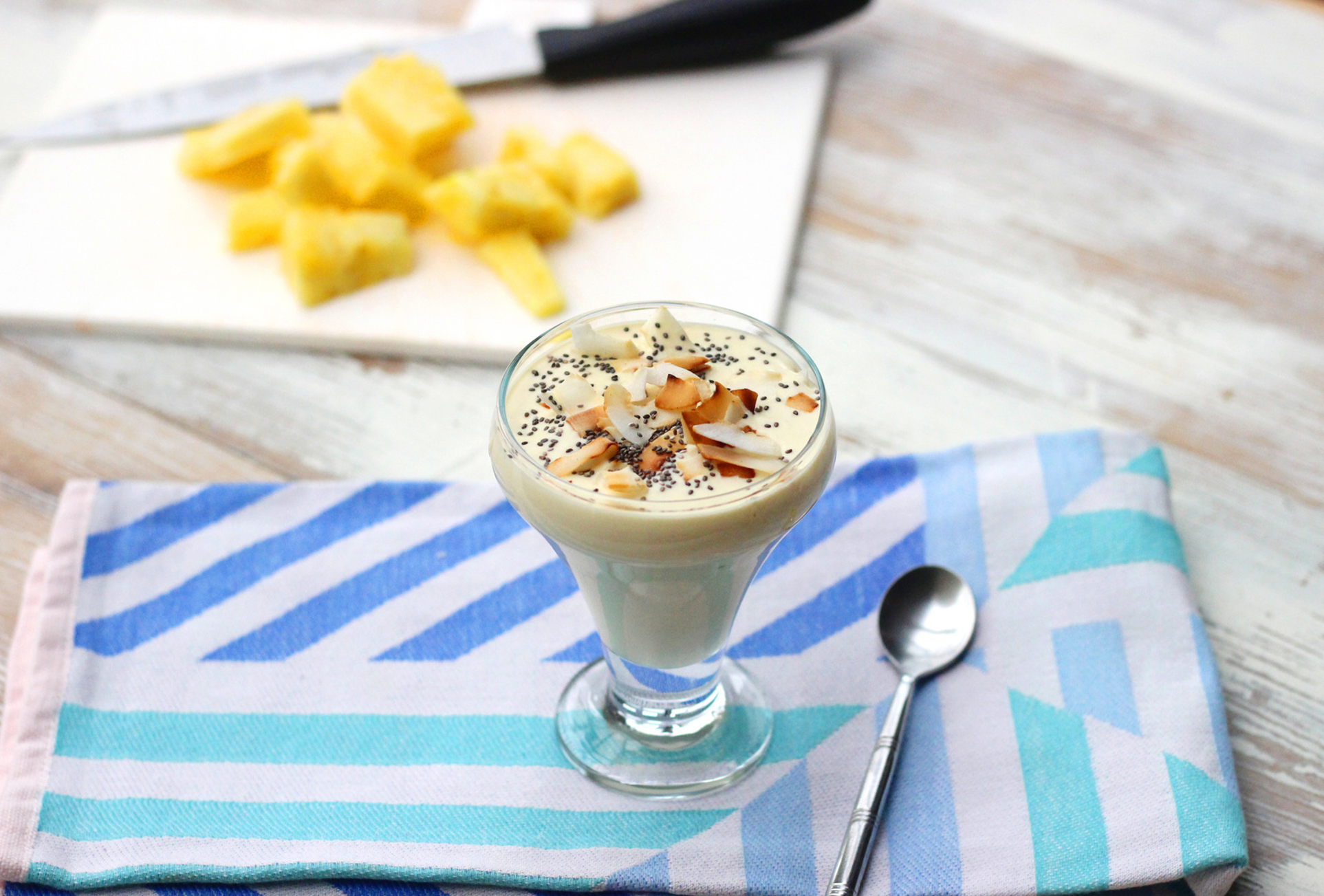 Tropical yogurt parfait with fresh pineapple, coconut flakes, and toasted granola